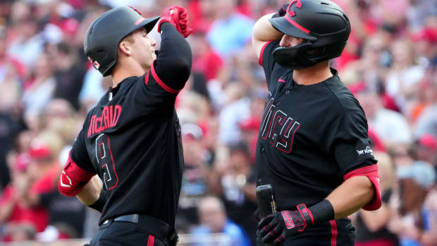 Cincinnati Reds shortstop Matt McLain (9) is congratulated by Cincinnati Reds first baseman Spencer Steer (7) after hitting a solo home run in the first inning of a baseball game, Friday, Aug. 4, 2023, at Great American Ball Park in Cincinnati.  